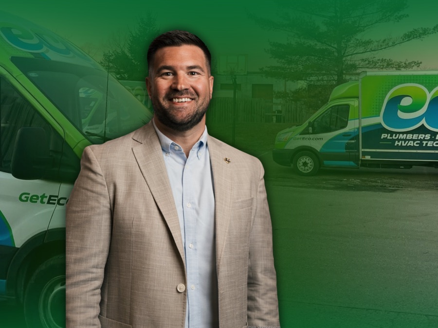 Mike Barnhart of ECO Plumbers, in front of the ECO fleet